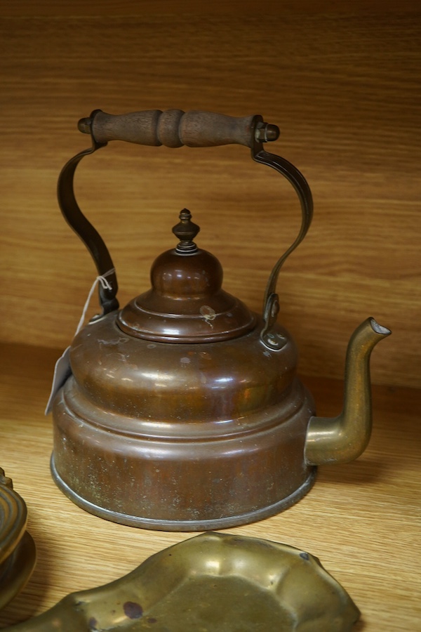 Four items of metalware comprising a candlestick, door knocker, tray and kettle, largest 26cm high